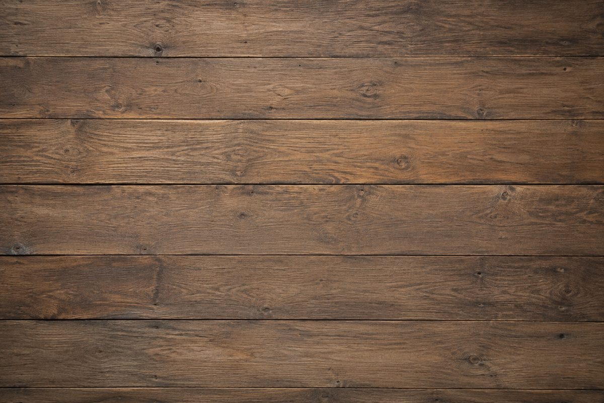 Rustic dark brown wooden planks background with visible wood grain texture and horizontal seams.